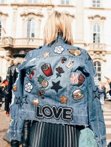 patches and pins on denim jacket